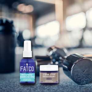 FATCO pit pack stank stop natural deodorant scotch pine and coriander pit spritz deodorizing spray against a gym setting background